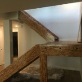 Wood staircase construction photo.
