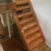 Wood staircase renovation photo from above.