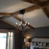 Custom wood beams on drywall ceiling.