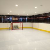 Custom basement hockey rink construction.