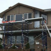 Close up of wood siding being replaced on Campbell River ocean view home.